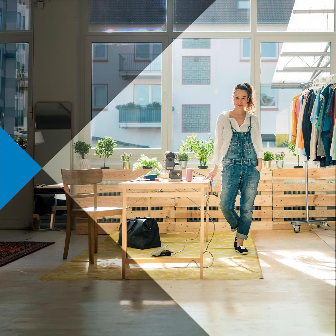 An Albertan business owner standing in her office after switching her banking to ATB