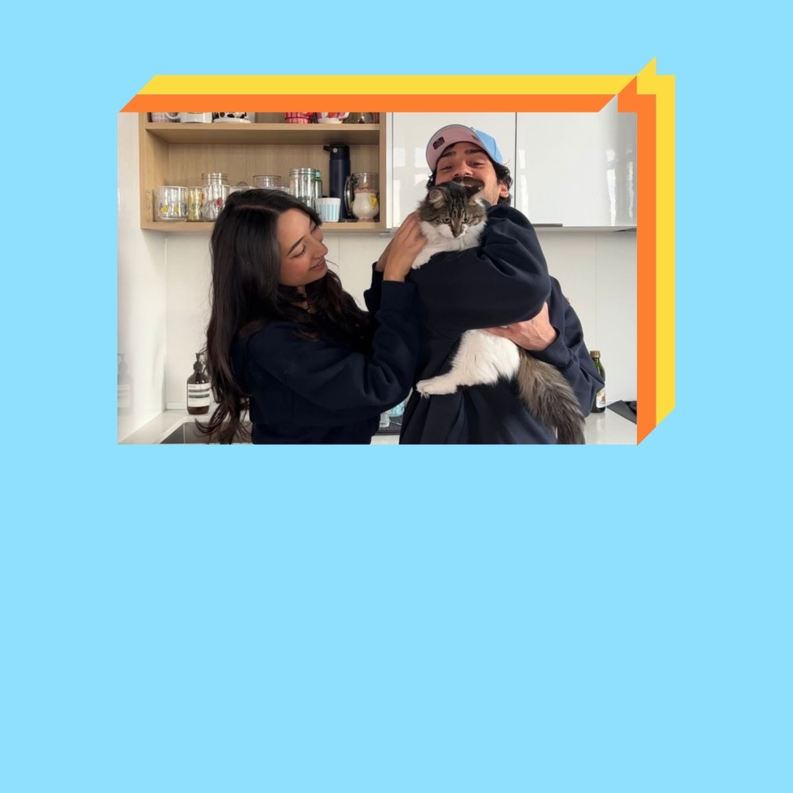 Neha, her husband and their cat.