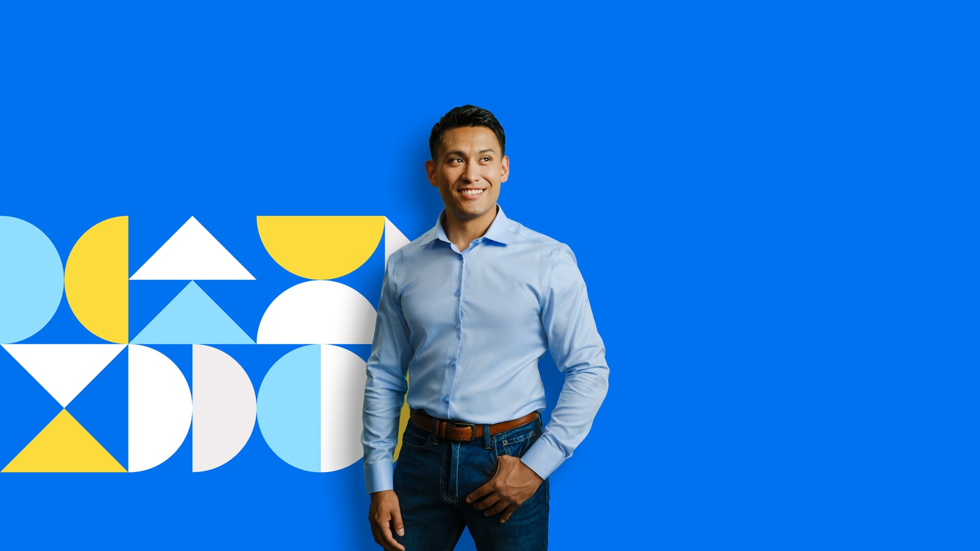 An Albertan standing in front of a blue background