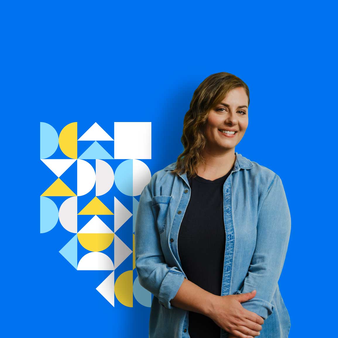 An Albertan standing in front of an Alberta graphic