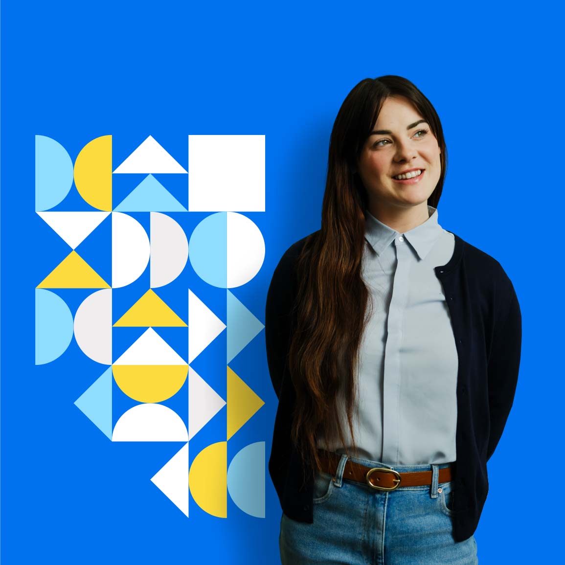 An Albertan standing in front of an Alberta graphic