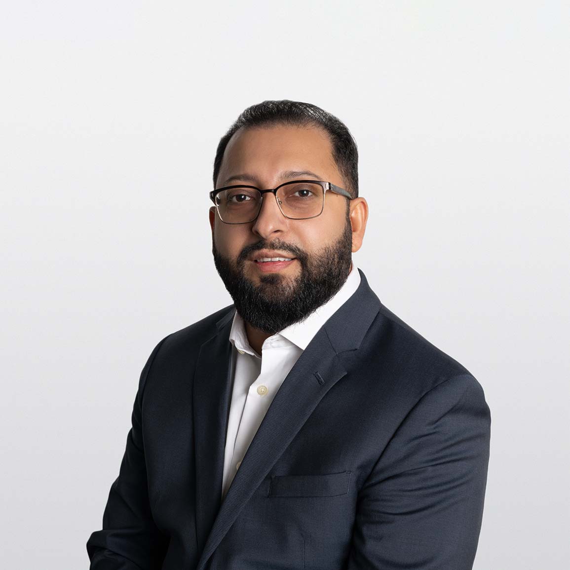  Image of Navdeep Dhaliwal, financial advisor on white background.