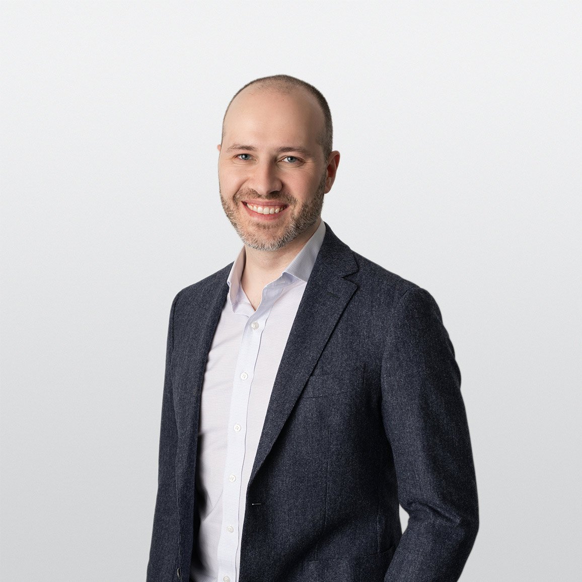 Professional headshot of Jason Maniotakis, Investment Counselor in ATBIM