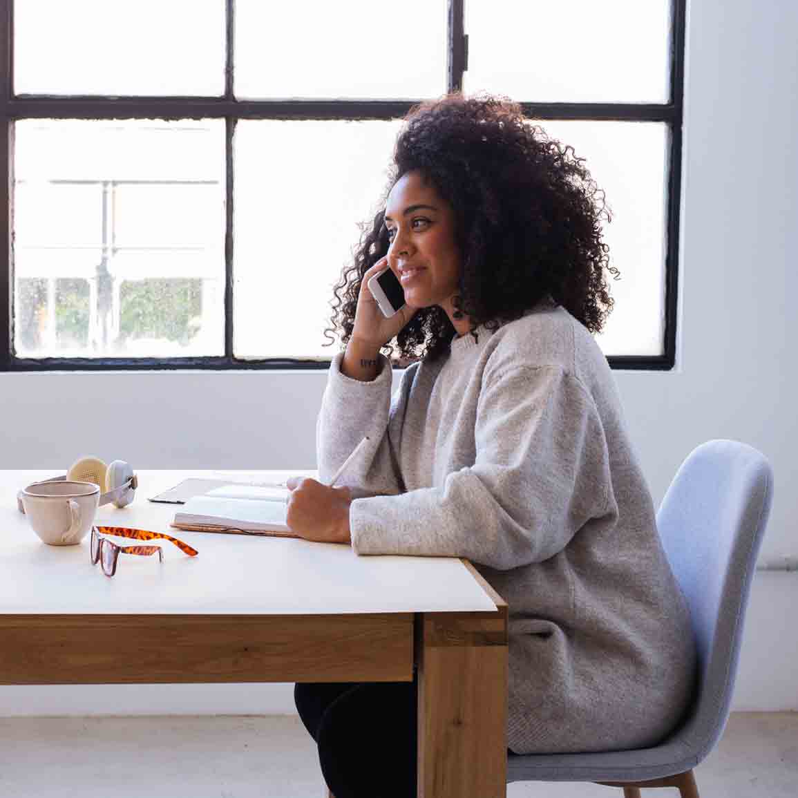 A lady is answering her phone