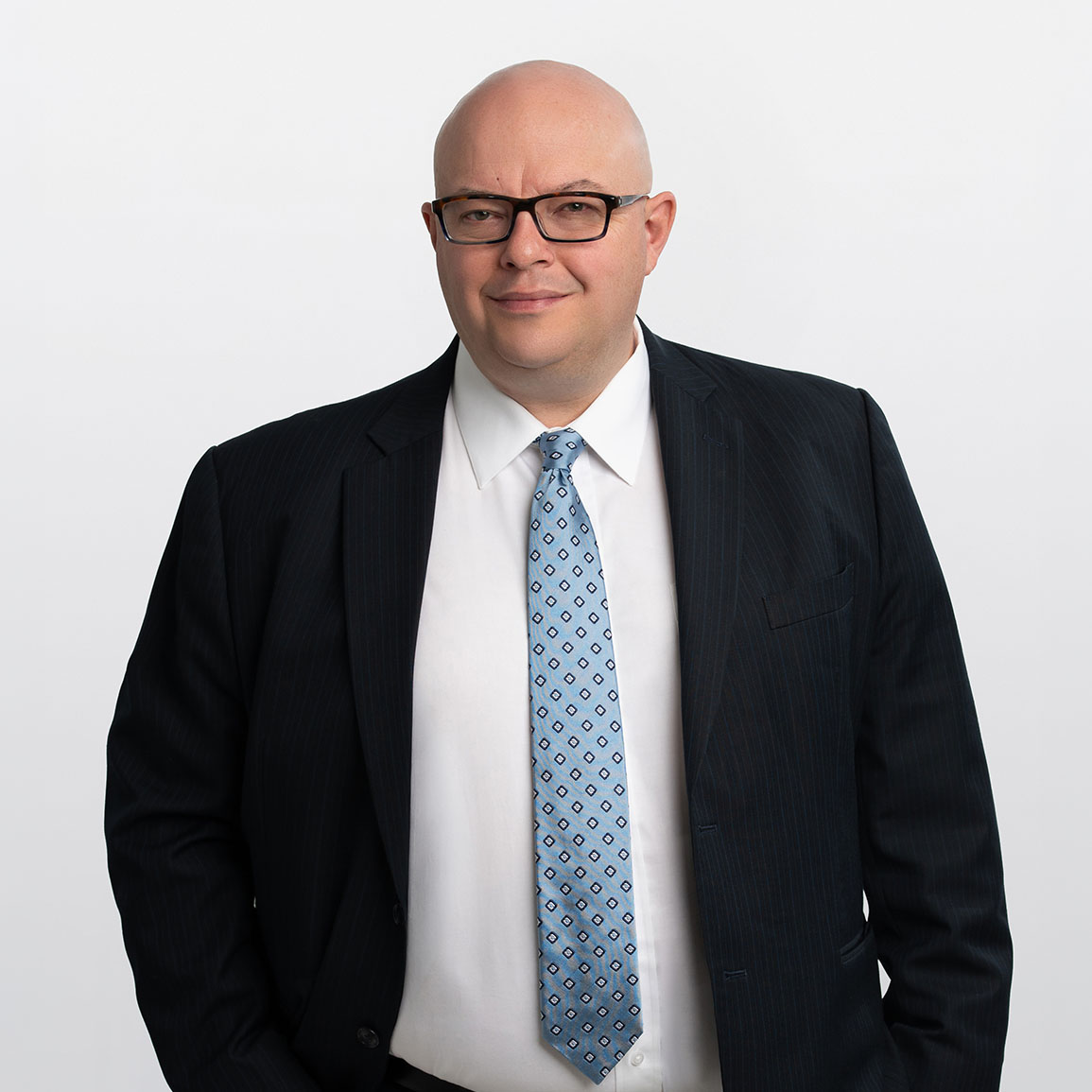 Professional headshot of Brett Phare, Investment Counselor in ATBIM